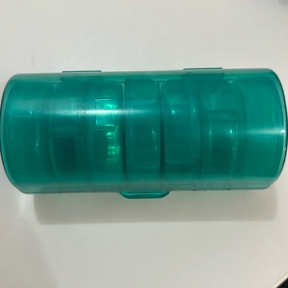 Pill organizer has 7 cute containers for each day of the week